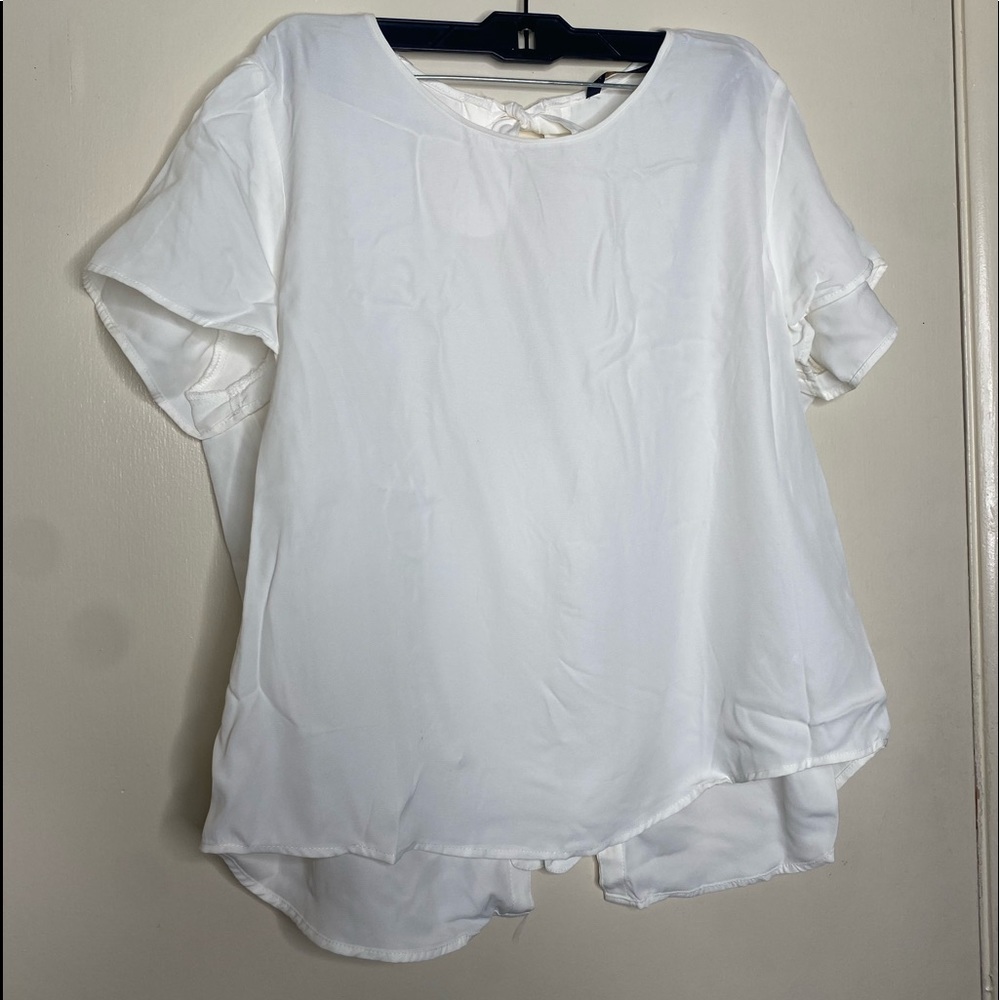Women’s white blouse with bow ties on back